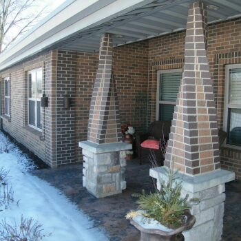 patio with swirling brick pillars